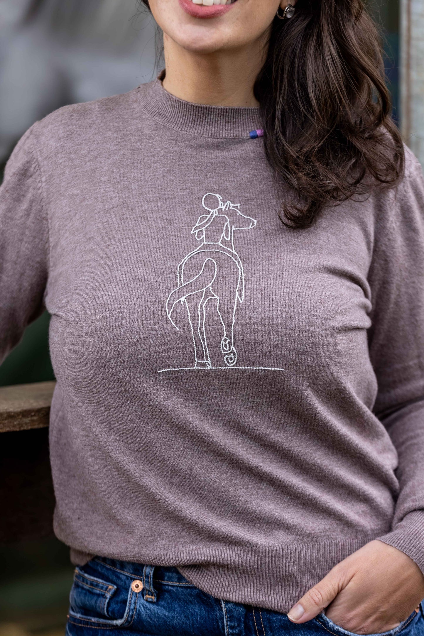 Pullover careca menina no cavalo